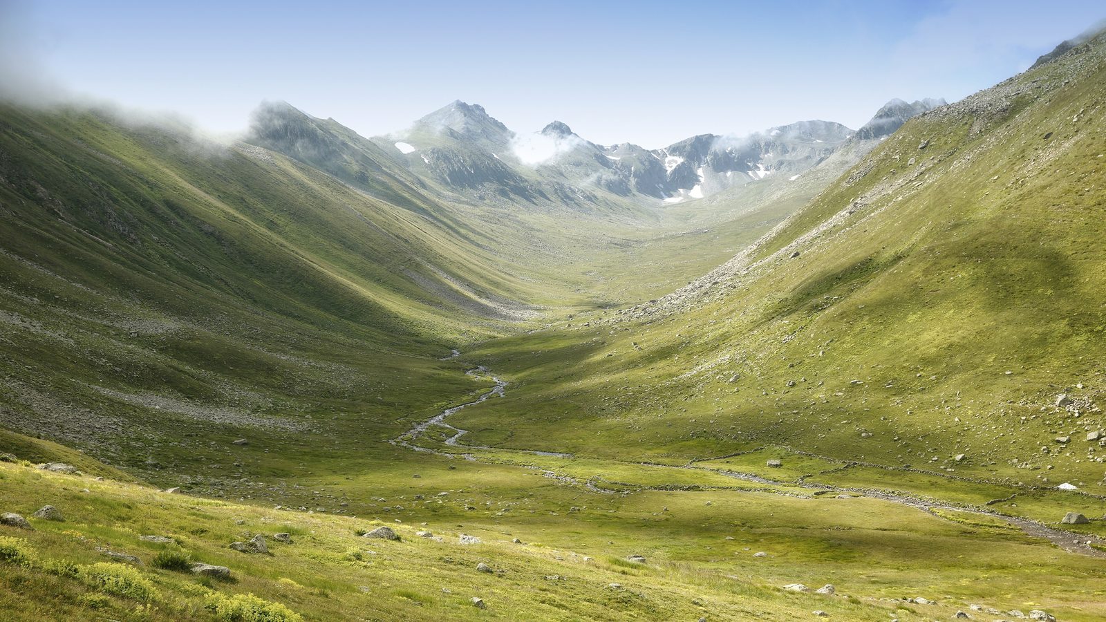 Kaçkar Mountains Traverse: a green glacial valley below the rocky peaks of the Kaçkar Mountains, north-east Turkey