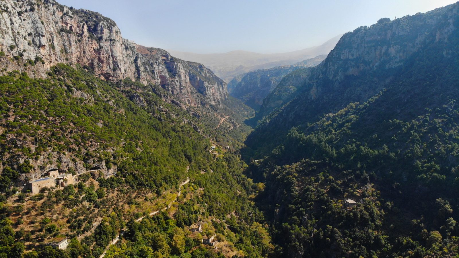 Lebanon Mountain Trail: the forested Qadisha valley and its limestone cliffs seen from the Qannoubine monastery, North Lebanon