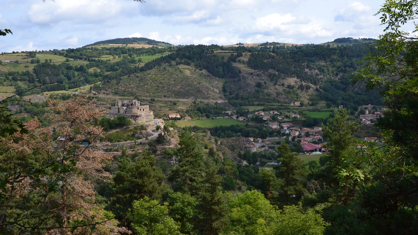 Stevenson Trail (GR 70): the village of Goudet and the ruined Château de Beaufort in the Loire valley, seen from the trail, France
