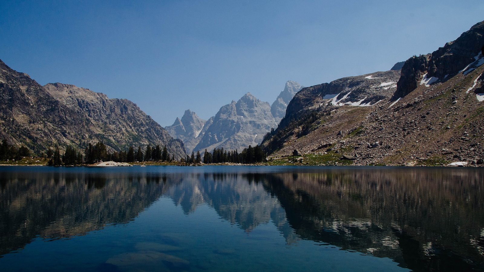 Teton Crest Trail: Lake Solitude reflecting the peaks at the head of the North Fork of Cascade Canyon, Grand Teton National Park, Wyoming